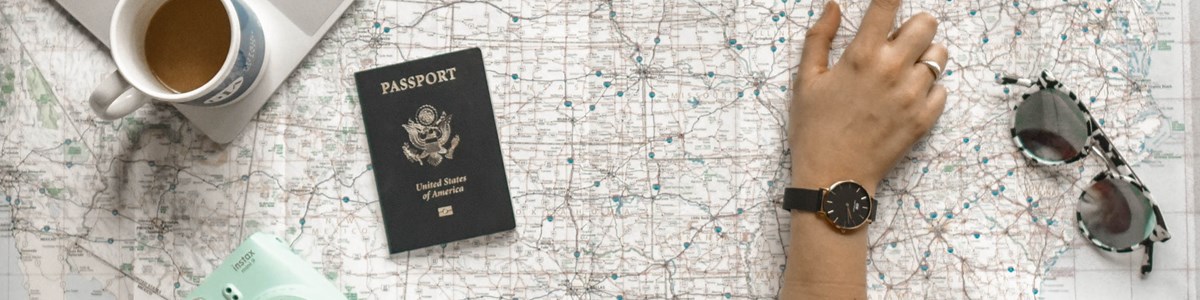 Person Pointing At Black And Gray Film Camera Near Macbook 1051075